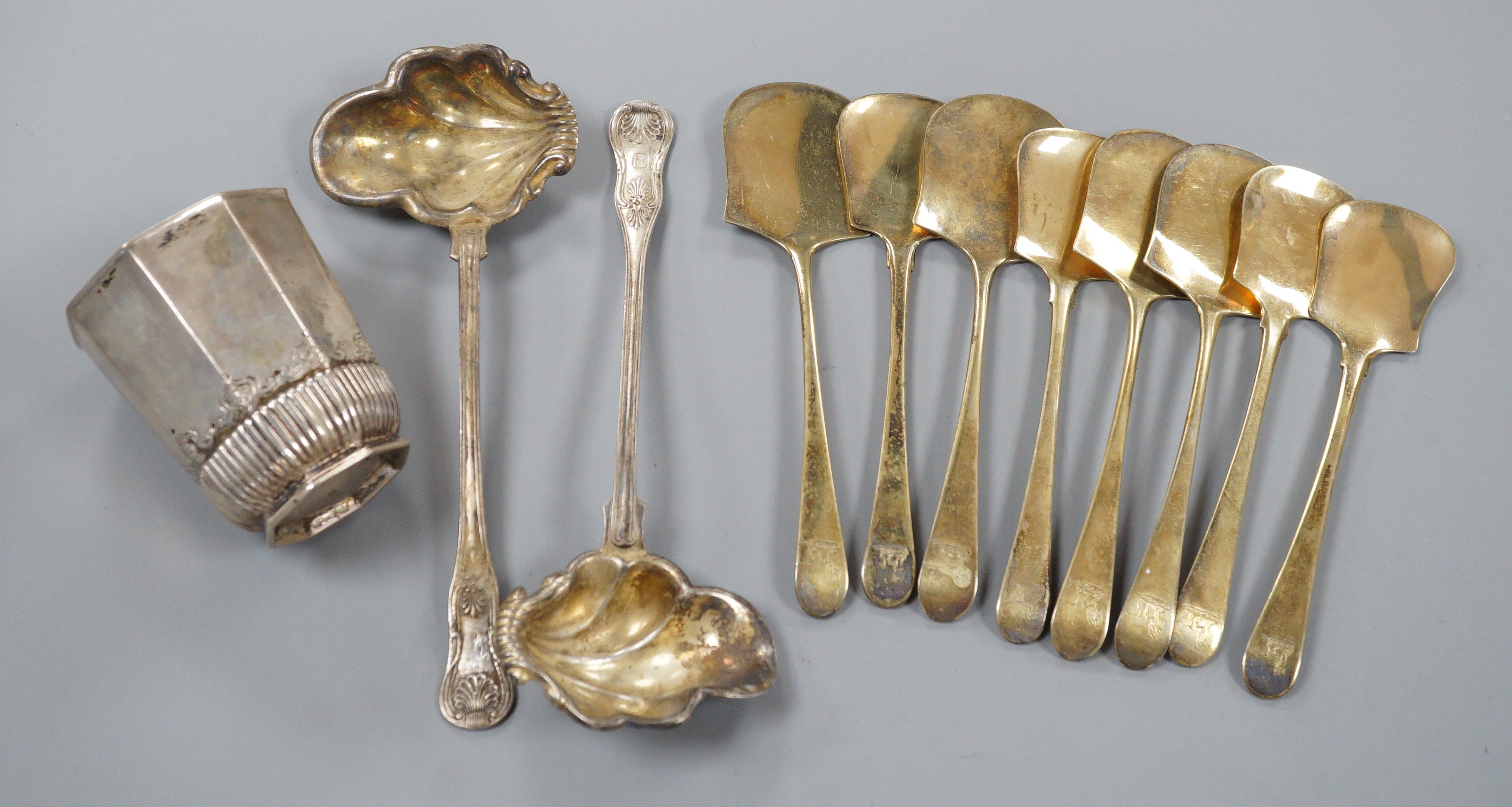 Eight late 18th century/early 19th century French gilt white metal servers, a pair of Swedish ladles and a 19th century German? beaker.